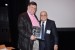 Dr. Nagib Callaos, General Chair, giving Prof. William Simpson a plaque "In Appreciation for Delivering a Great Keynote Address at a Plenary Session."